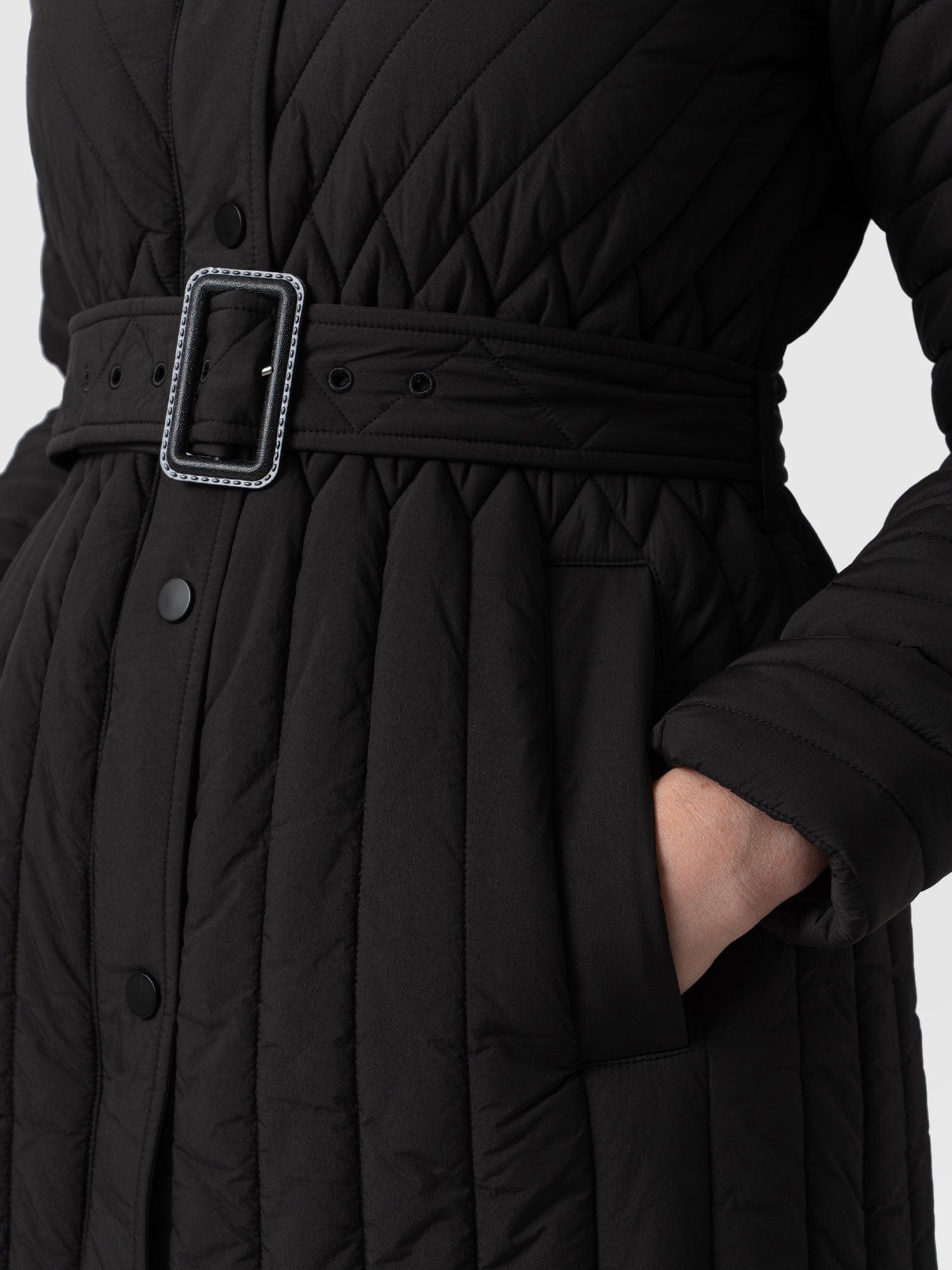 Black belted quilted store coat