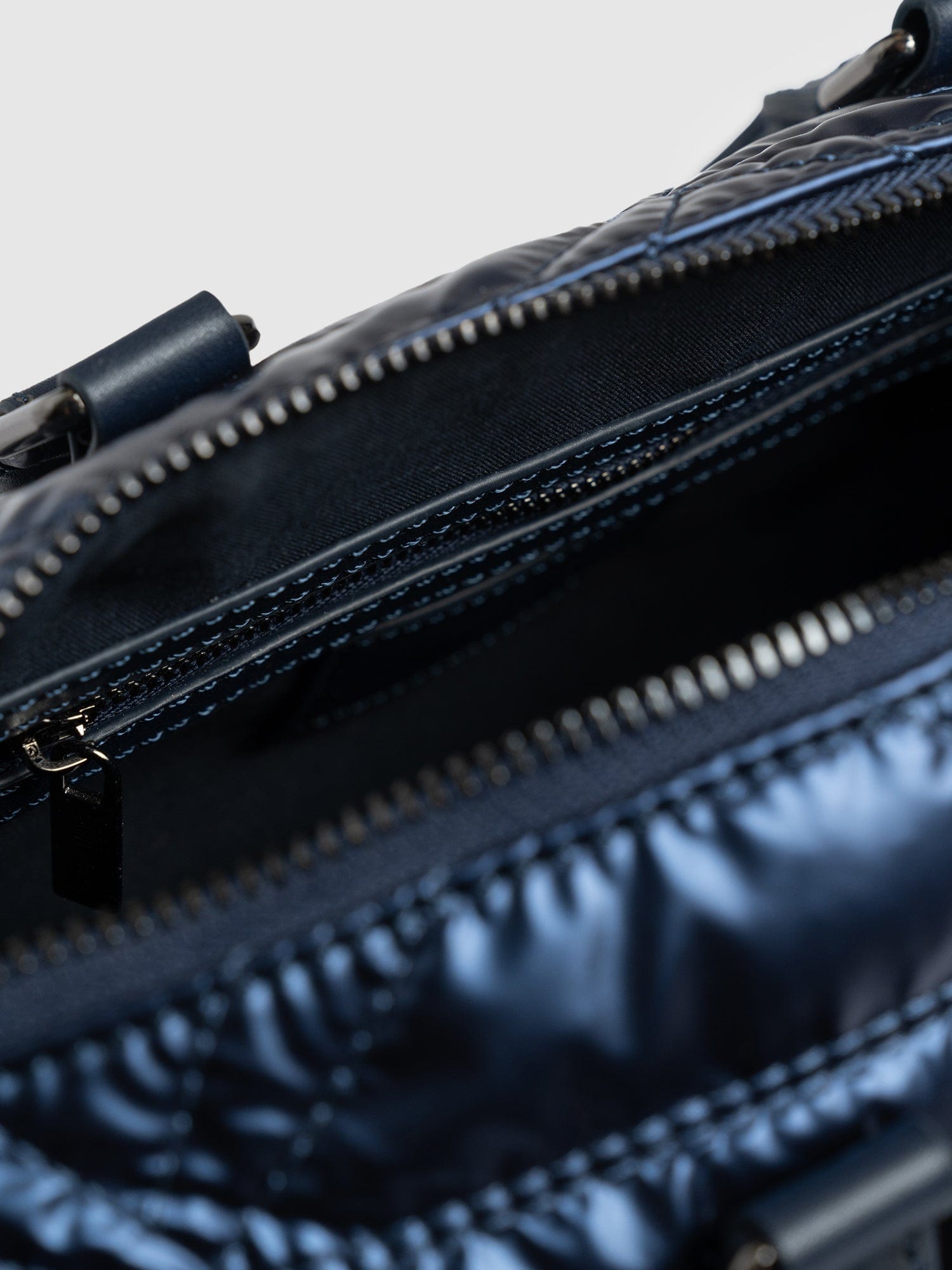 Quilted Maeve Duffle Bag Metallic Navy - Women's Bags | Saint + Sofia® UK