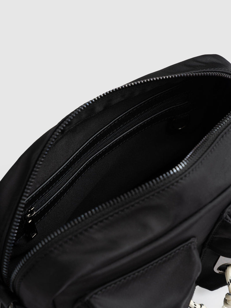 ASOS DESIGN multi pouch cross body bag in black nylon