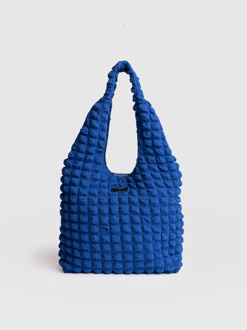 S blue tote bag
